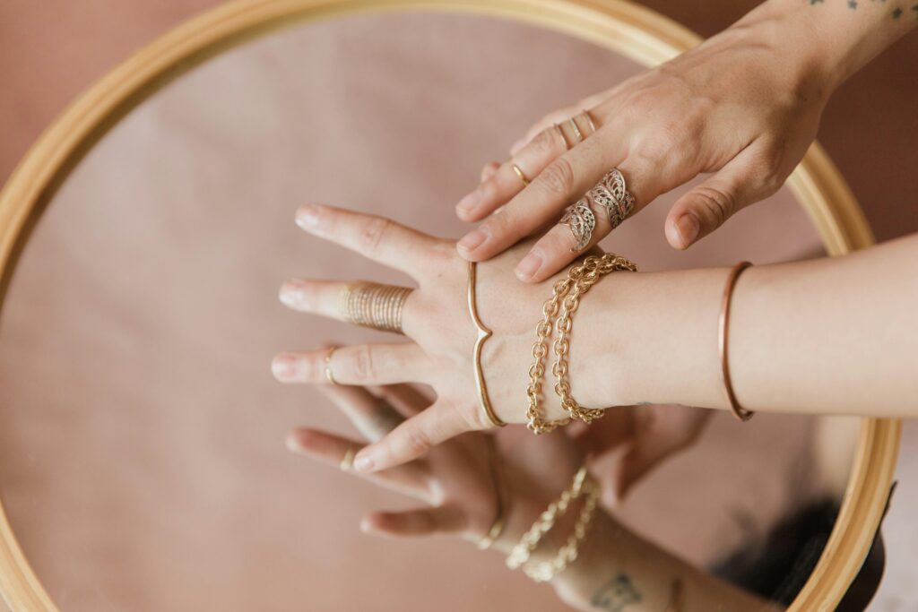 "Different styles of silver bracelets displayed on a wrist"